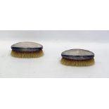 Pair of silver-backed hairbrushes of oval form with engine-turned decoration