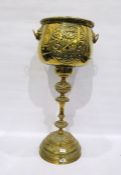 Brass jardiniere and stand embossed with armorial bearings on a stepped base