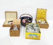 Quantity of sewing equipment to include buttons, decorative old pincushions, fitted sewing basket