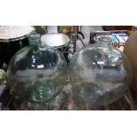 Two large glass wine storage jars