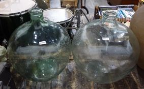Two large glass wine storage jars