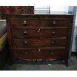 19th century mahogany chest of two short over three long drawers, with shaped apron and tapering