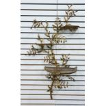 Gilt metal wall bracket in the form of foliate branch with three demi-lune graduated trellis shelves