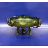 Art Nouveau iridescent green glass bowl of folded circular form, set within a pierced metal pedestal