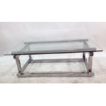 Rectangular glass-topped coffee table on a chromium base, 120cm  measurements are 120 cms wide -, 40