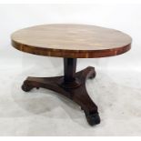 George III rosewood breakfast table with circular top and on octagonal tapering column support,