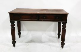 19th century mahogany two drawer desk on turned and reeded supports, 104.5cm