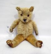 Golden plush teddy bear with stitched nose and glass eyes, c.1928-1930, 52cm tall (pads worn and
