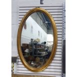 Oval wall mirror with gilt-effect moulded oval frame and a small collection of further wall mirrors