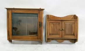 Oak single glazed door wall-hanging display cabinet enclosing shelves and a pine wall-hanging two-