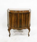 Reproduction walnut serpentine-front side cupboard with deep moulded border, the pair of panelled