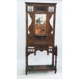19th century oak hall stand with mirrored back, featuring foliate carvings, coat hooks above the