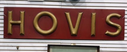 Large Hovis metal advertising sign, the letter highlighted in gold on an orange ground, 160cm long