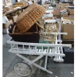 White painted florist's hand cart together with wicker baskets and a vintage style white painted