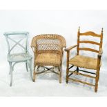 Three grey painted cane seated chairs, a rush-seated beech framed armchair and two wicker chairs (6)