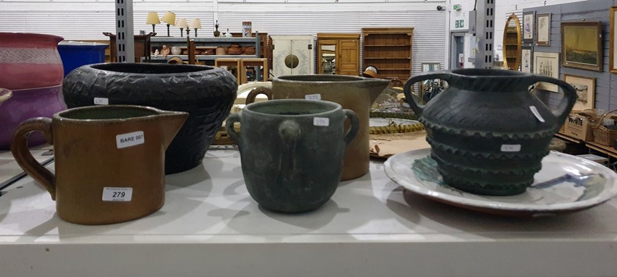 Collection of stoneware jugs, glazed earthenware plate and other items