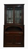 19th century cabinet with moulded pediment above astragal-glazed doors enclosing shelves, raised