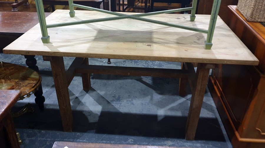 Pine plank top dining table on square section supports