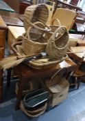 Large collection of wicker baskets together with walking sticks