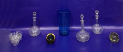 A glass paperweight, an ashtray, three decanters and a set of finger bowls (please note that the