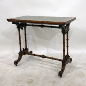 Victorian figured walnutwood and leather inlaid small writing table with twin end pillar supports,