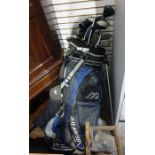 Maxwell, Slingshot and other golf clubs in a Mizumo carry bag together with a green trunk and
