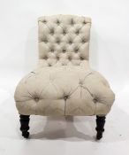 Button-back salon chair with cream foliate patterned upholstery, turned front legs to brass caps and