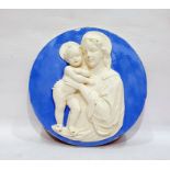 Modern Italian blue and white wall plaque in the style of Della Robbia of circular form depicting
