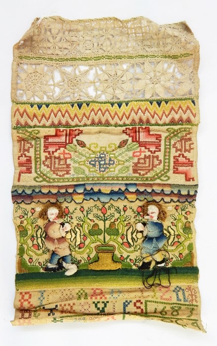 Late 17th century band sampler on natural linen, worked in coloured silks with numerous stiches
