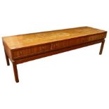 Rectangular coffee table with three double-sided drawers, in teak, on square section supports, 149.