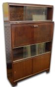 Mid 20th century Minty cabinet with one bookcase tier, with sliding glass doors above fall-front,