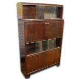 Mid 20th century Minty cabinet with one bookcase tier, with sliding glass doors above fall-front,