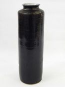 Studio stoneware vase, slight everted rim, shouldered and cylindrical with black glaze, having