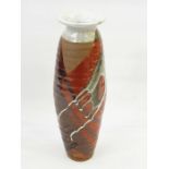 20th century studio stoneware vase with everted rim, elongated ovoid body, with grey, red and