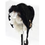 Victorian bonnet in velvet and cotton, trimmed with lace and ostrich feather with a white frill