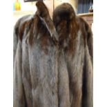 Dark full-length mink coat with bell sleeves and cuffs, silk lining