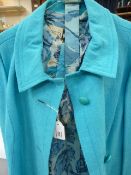 Cresta matching turquoise linen coat and chiffon flower-pattern dress, a raw silk blue shirt dress