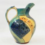 Large terracotta jug by Janet Rogers, shouldered and tapering, abstract design, in yellow, blue