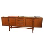 20th century G-Plan teak sideboard with four central drawers flanked by two cupboard doors with