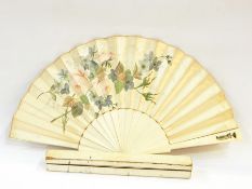 Painted silk fan with bone sticks, monogram and coronet on one guard stick, in original box, by J