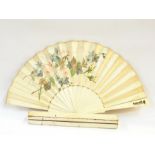 Painted silk fan with bone sticks, monogram and coronet on one guard stick, in original box, by J