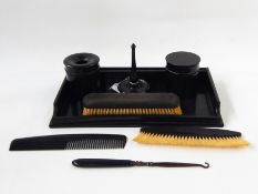 Ebony dressing table set comprising ring holder, brush pots, brushes and tray