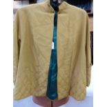 1950's mustard yellow evening jacket with quilted cuffs and deep quilted hem, a cut velvet evening