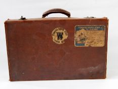 Vintage leather suitcase bearing 'Cunard White Star Cabin Club' label (with loss) and 'Cunard