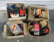 Assorted car parts, some still in packaging