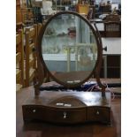 19th century mahogany and banded oval dressing table mirror with serpentine front, three drawers and