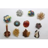 Quantity of costume jewellery to include brooches set with fishermen flies, assorted necklaces,
