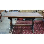 Early 20th century oak trestle table with rectangular top, the shaped end supports with stylised
