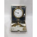 Silver-mounted travelling clock, the Swiss clock with eight-day movement and enamel dial, in