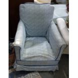 Early 20th century low salon chair in blue foliate loose covers